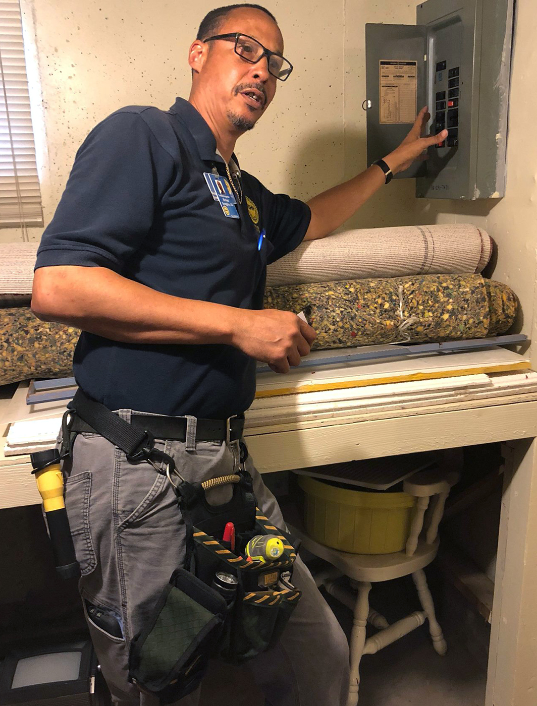 One of our certified home inspectors, Richard Scroggins, in front of an electrical box